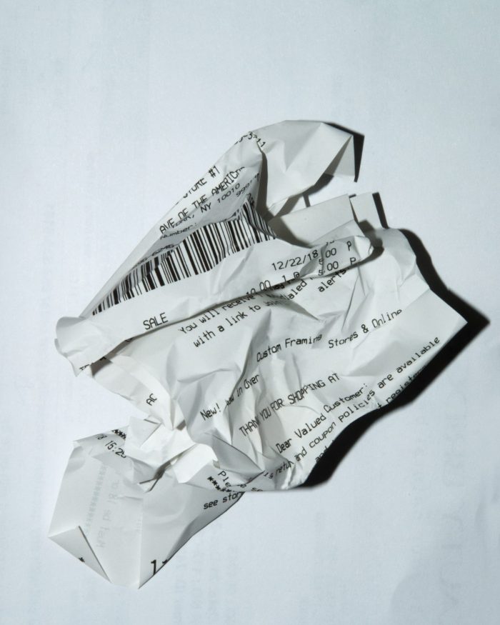 crumpled up receipt paper