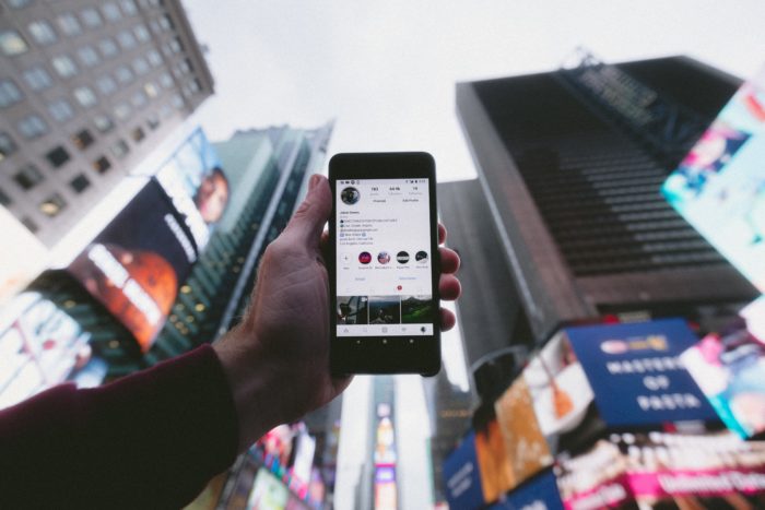 phone held up to city skyline