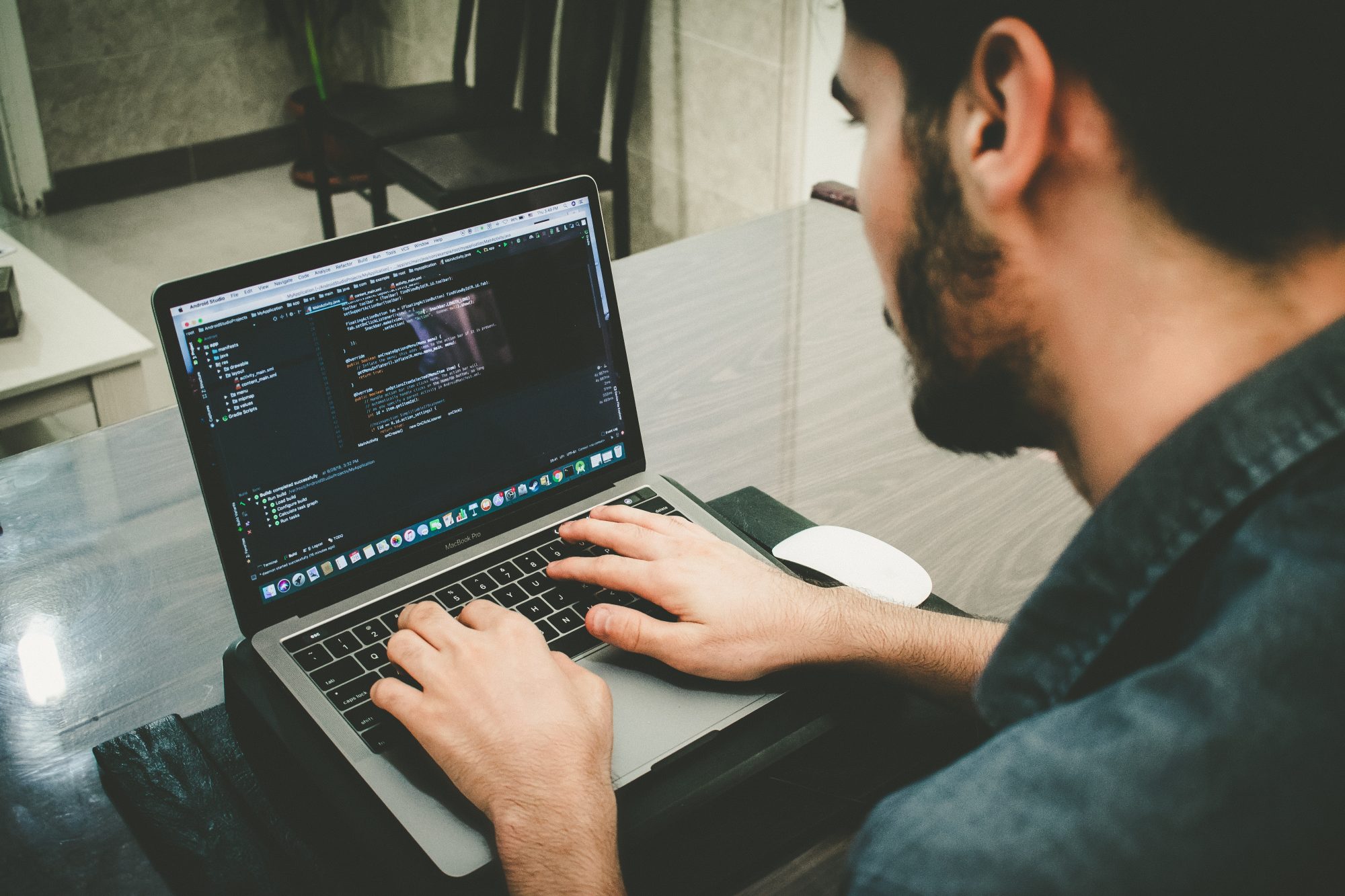 Man updating software on laptop