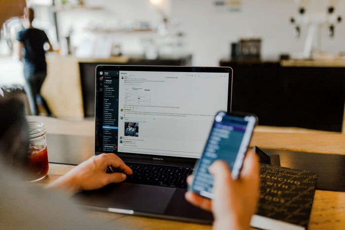 Man on phone and laptop 