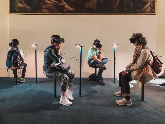 People sitting a room doing VR