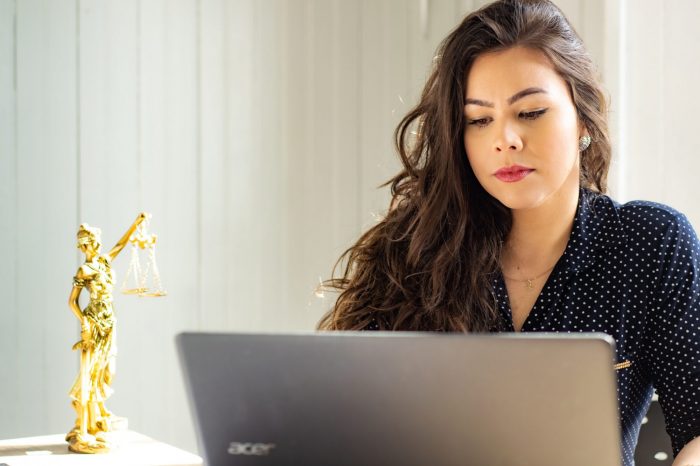 a woman working from home on her laptop