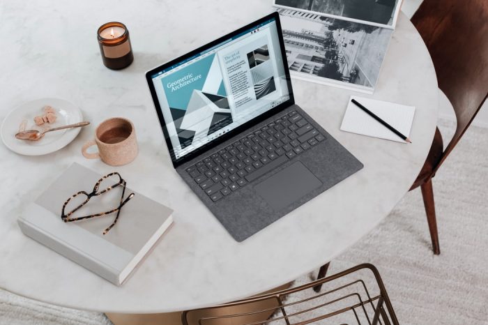 A laptop on a white table