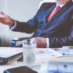 Man in suit at table