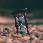 hourglass on rocks