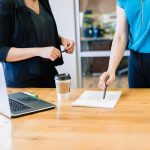 Two women standing in an office